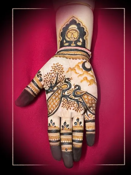 A striking design featuring two peacocks under a crescent moon. The dark, bold tips on the fingers create a beautiful contrast with the detailed artwork.