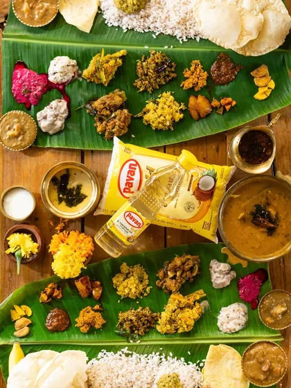 Another flat lay of the Onam sadhya, this time with the product (coconut oil) placed differently to show various composition options.
