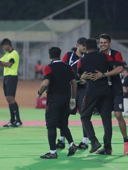 Post-match celebrations with the team and staff. Acknowledging the effort and celebrating small victories is important in a long tournament.