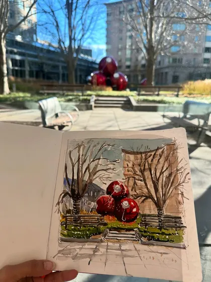 My finished painting held up against the sunny outdoor scene, showing the contrast between the warm light and my cool-toned interpretation.