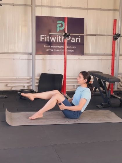 A teaser variation with bent knees. This makes the challenging exercise more accessible for those still building their core strength.