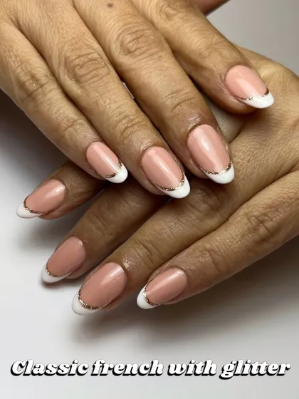 The perfect wedding guest nails. A classic French manicure with a delicate line of fine silver glitter to add a touch of sparkle that goes with any outfit.