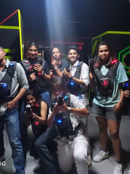 A group of girls ready to battle it out in the laser tag arena.