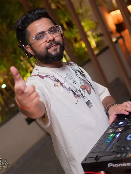 Interacting with the crowd at Perissa Aravali. A good DJ connects with the audience, and I make sure to bring that personal touch.