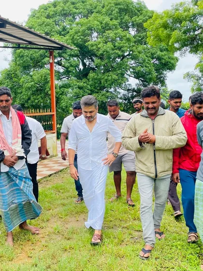 Walking through the serene landscape near Malligar village with local associates. These informal walks are often where the most honest and insightful conversations about our community's future take place.