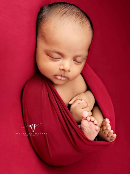 A peaceful and content expression from a sleeping baby.