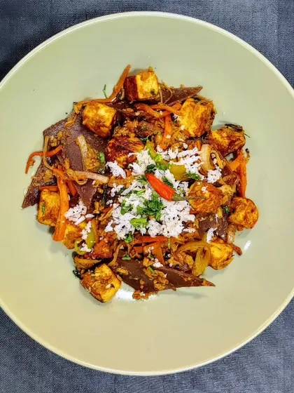 Street Food Made Healthy: Paneer Kottu Parotta: Originally a street food from Madurai, Kottu Parotta is a delicious mix of shredded flatbread and spices. We make ours guilt-free with a protein-packed roti made from ragi, bajra, and jowar instead of maida.