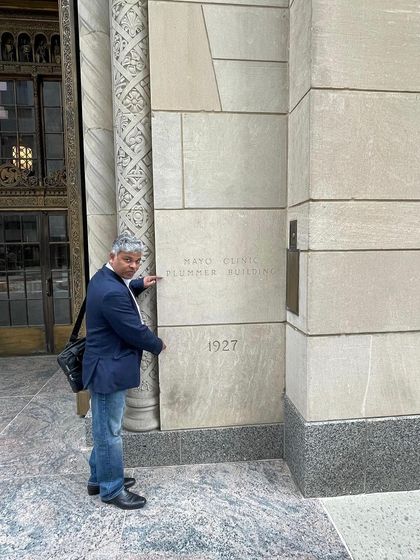 Pointing to the Plummer Building, established in 1927. The history of the Mayo Clinic is a powerful reminder of the enduring impact of a practice built on strong values.