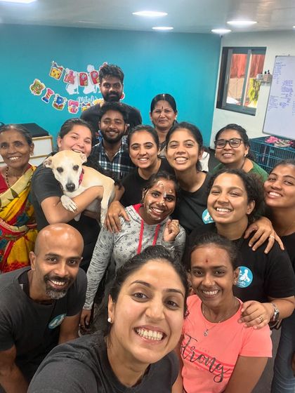 A happy, smiling group selfie. The bond we share as a team is what makes our work so joyful and effective.