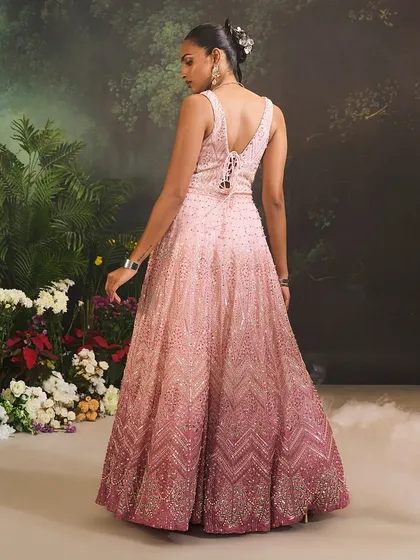 The Celine Gown features a beautiful cascade of ombre tones from soft pink to deep rose. I adorned it with delicate embellishments that shimmer with every movement, making it a romantic choice for an evening affair.