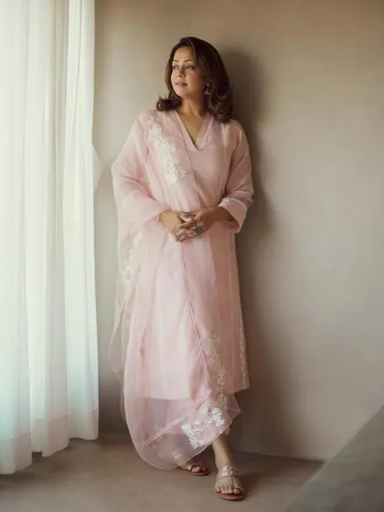 The full pink kurta set, an embodiment of grace and simplicity, perfect for a daytime promotional event.