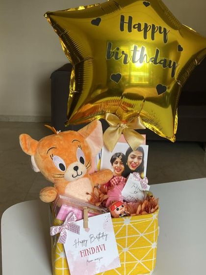 A cute birthday hamper featuring a Jerry plush toy from Tom & Jerry, a personalized photo, and a 'Happy Birthday' star balloon.