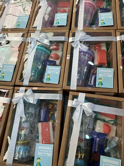 The curated kids' hampers, beautifully packed and tied with white ribbons, ready to make any child's day.
