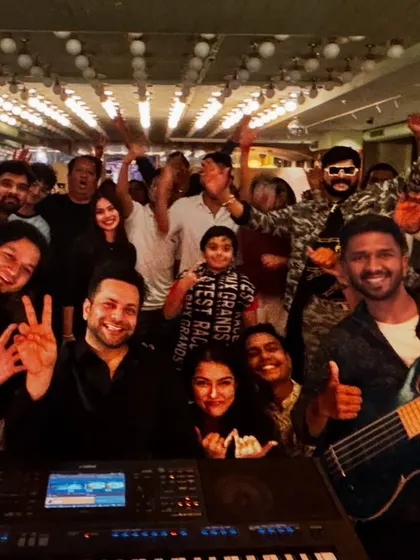 A happy post-gig selfie with the band and some of the event guests. We love connecting with our audience and making them feel like part of our family.