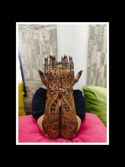 A gorgeous full-arm Dubai-style mehendi for a singer attending her brother's wedding. The flowing, intricate patterns are perfect for making a statement.