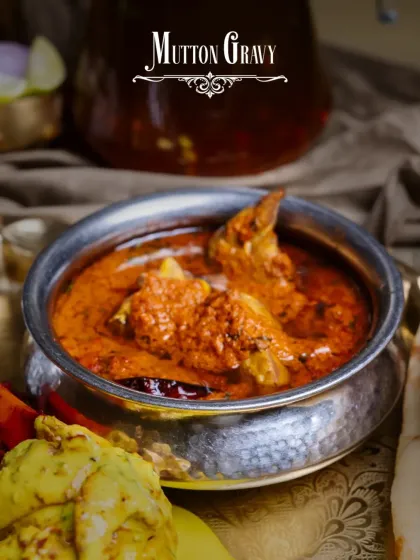 The rich and aromatic Mutton Gravy from our Akbari Thaal. Slow-cooked with traditional spices, it's the perfect companion for our soft, fluffy naans.
