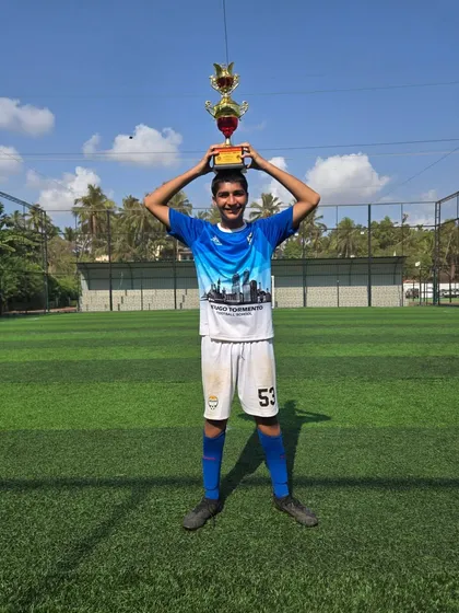 A creative pose with the trophy from one of our U14 champions.