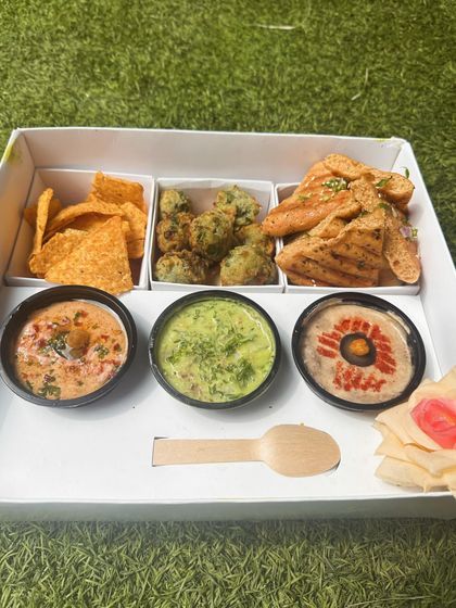 Another view of the well-organized and delicious Mezze Box, perfect for a Mediterranean-themed snack time at home.