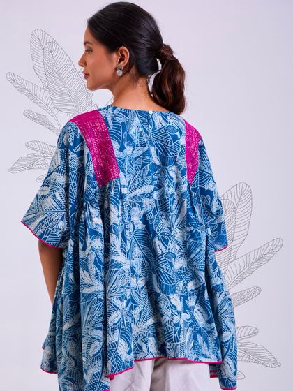 The back of our Chaaya oversized top, showing its generous, flowing silhouette. This piece is designed for comfort and ease, perfect for a relaxed day.