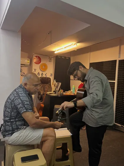 It is never too late to start. Here I am guiding one of our adult students through his guitar lesson. We welcome learners of all ages, whether you are 6 or 60, and create a comfortable space for you to pursue your passion.