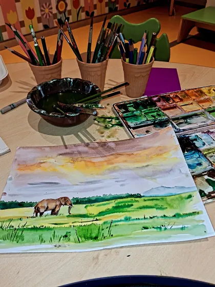 A complete view of our watercolor painting setup. We provide all the necessary supplies, including high-quality paints, paper, and brushes, so you can focus on your art.