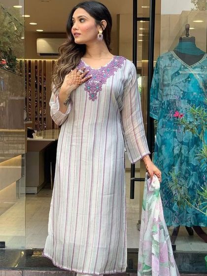 An off-white kurta with a lovely printed dupatta. The heavy thread embroidery on the neckline adds a touch of festive glam.