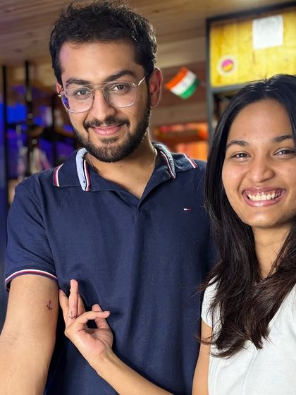 A happy couple showing off their new matching anchor tattoos. It's always great to see clients celebrating their bond with my art.