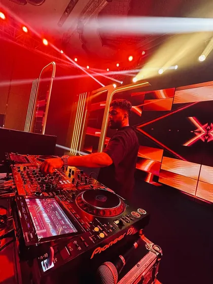 Another angle showing my hands on the decks. Every movement is precise, aimed at building and releasing tension for the dance floor.