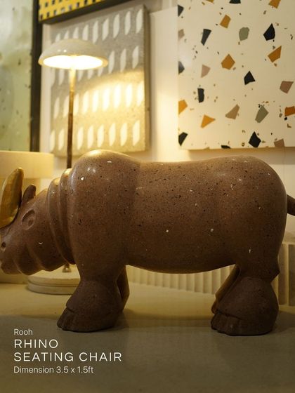 This side profile of the Rooh Rhino Seating Chair shows its solid, earthy form. Placed in our studio, it demonstrates how a single, powerful piece can transform a space and serve as both striking art and comfortable seating.