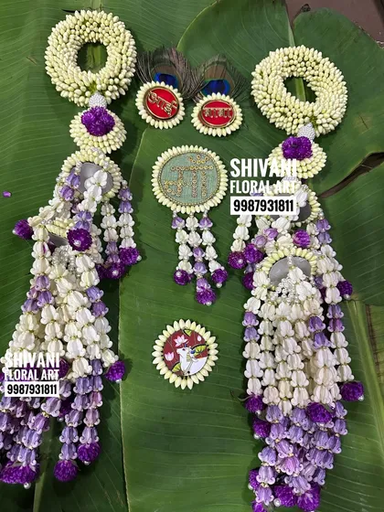 A custom kalira set for a baby shower, featuring purple accents and a unique 'Maa' brooch for the hairstyle.