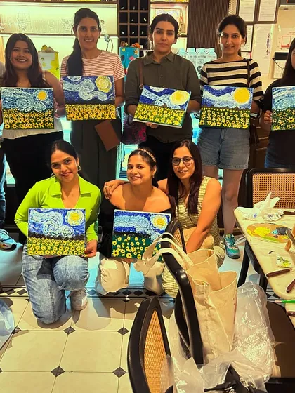 A large, happy group from one of our workshops, all with their fantastic textured 'Starry Night' paintings.