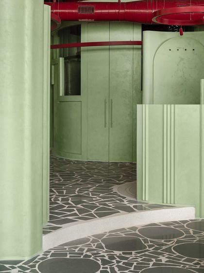 A view down a corridor in the 'Sorbet' retail space, where our patterned terrazzo floor acts as a visual pathway, guiding customers through the store.