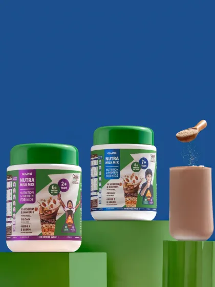 A creative shot of a kids' nutrition mix, with powder being dusted into a glass, set against a bold, colorful background.