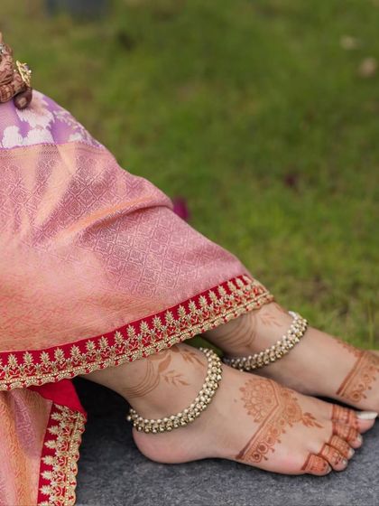 A detail shot focusing on the custom hand-embroidered border I added to this lavender Kanchivaram saree. It's these small, personalized details that make an outfit truly unique.