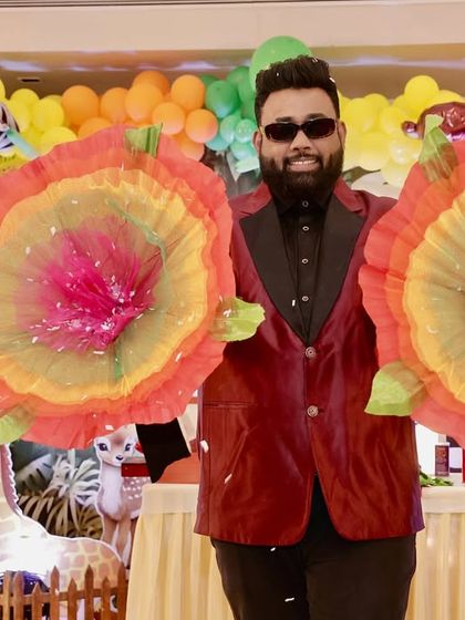 A colorful finale to a trick. Producing giant paper flowers always brings a 'wow' from the kids and adds a great visual splash to the birthday party.