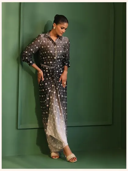 This ombre polka dot dress is a modern and playful piece. The wrap-style front and draped silhouette are incredibly flattering.