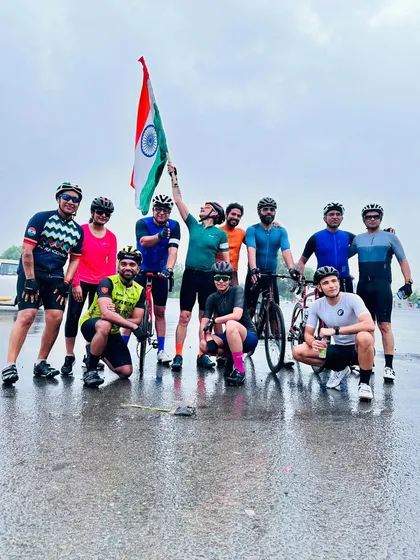 The full team, soaked but spirited, celebrating Independence Day together.