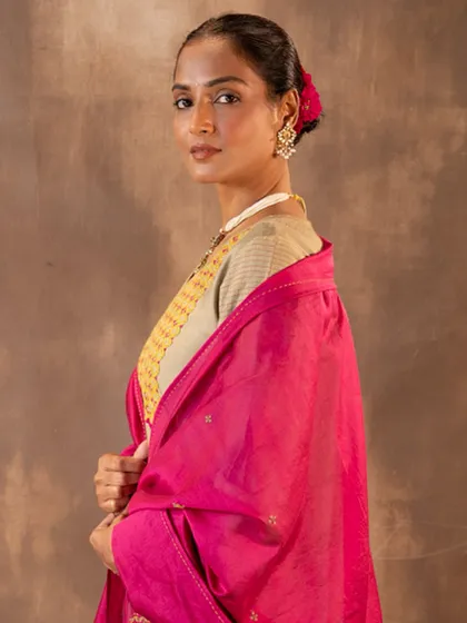 A moment of quiet elegance. This image captures the beautiful drape of the silk dupatta and the intricate embroidery of the Ruhani Sage Green Kurta, a combination that feels both timeless and festive.