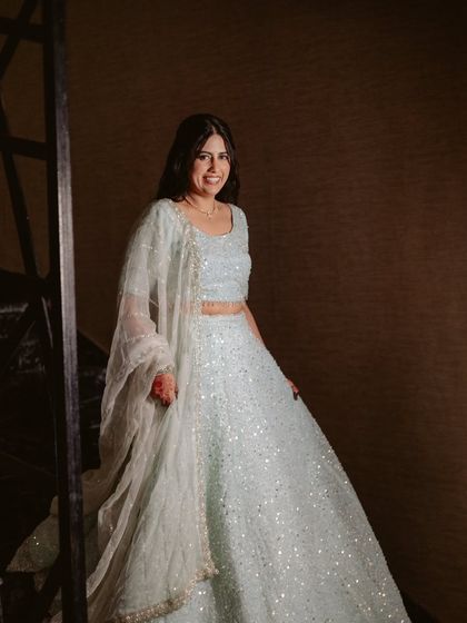 A happy, twirling shot, the movement showing off the sparkle of her outfit.