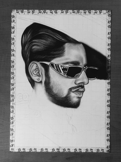 A step-by-step look at my 85-hour portrait of Baseer Ali. You can see the grid lines and how I build up the layers of graphite and charcoal to create a photorealistic effect.