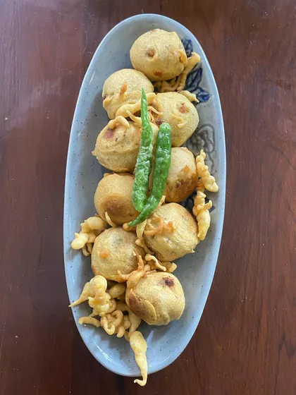 A top view of the Mini Vadas. These small, round fritters are made from a lentil batter and are a popular South Indian tea time snack.