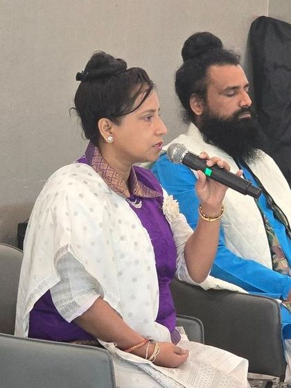 Maa Aditiji speaking during our Satsang and Meditation program in the USA. This close-up shot captures the focused and instructional nature of her guidance during the session.