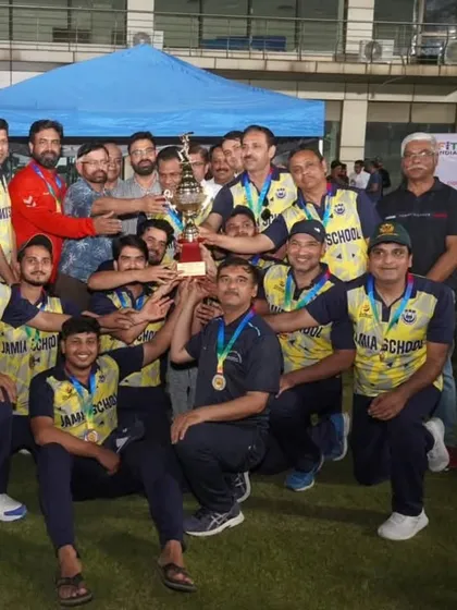 The pure joy of winning. The Jamia School team celebrates with the trophy after the conclusion of the Jamia Premier League T-20 staff tournament. For me, it's all about creating these moments of shared success and team spirit.