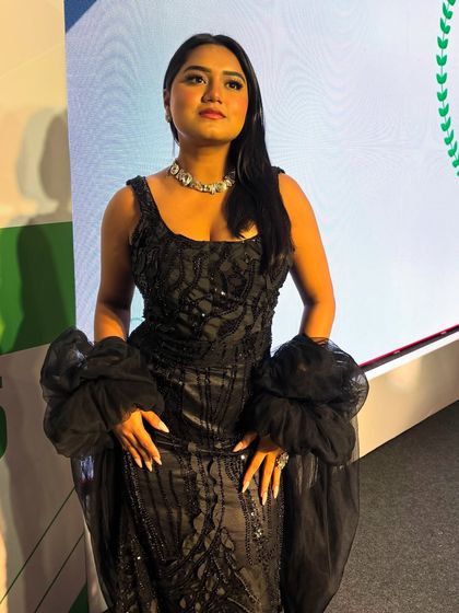 Another look at the detailed black gown for the Housiey gala. The right outfit helps me embody the glamour of an awards night.