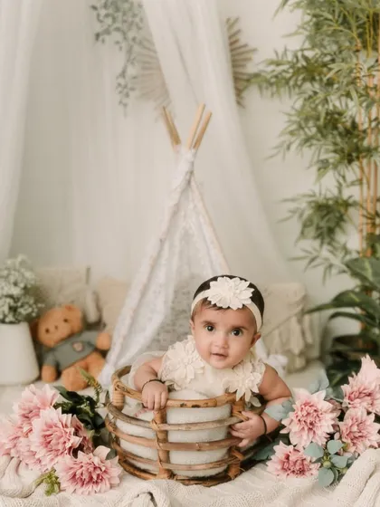 Celebrating six months! This half-birthday portrait in a boho-style setup is a perfect way to mark the milestone.
