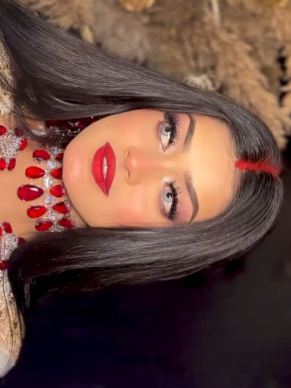 A creative angle of the Aishwarya look, showing the intensity of the red lips and the clean eye makeup.