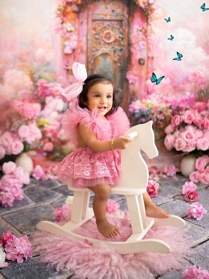 A ride on the rocking horse through a magical pink garden. A classic and beloved shot for any toddler.