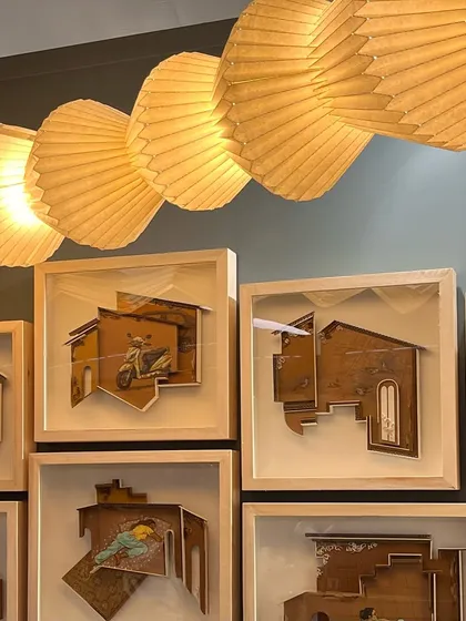 Framed architectural art pieces seen at India Design ID. These three-dimensional paper-cut models explore the concept of home and memory, a theme that is central to our own practice.