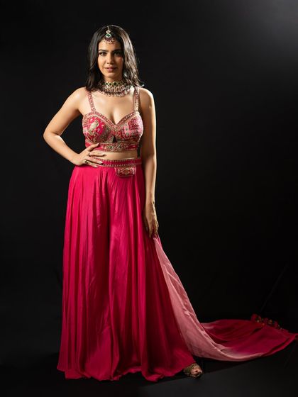 A full-length shot showing the flow and grace of this pink outfit. It's important to feel comfortable yet glamorous on stage.