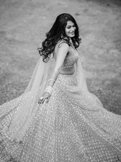The same bride in a timeless black and white shot, capturing the movement and joy.